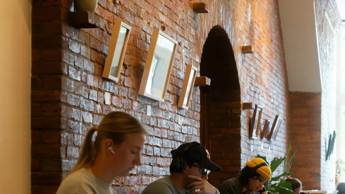 International students working on laptops in a cafe near campus in the USA