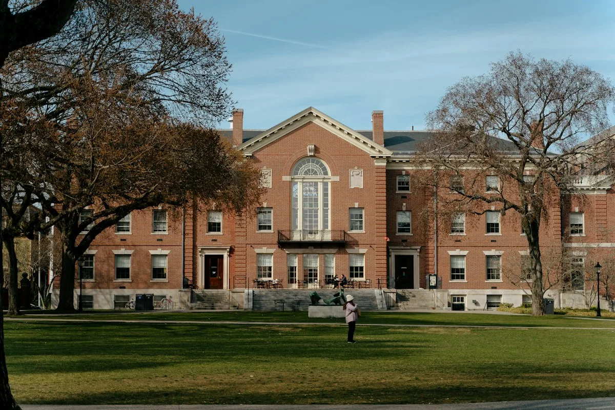 Student outside a university building, where international students can work in the USA on campus