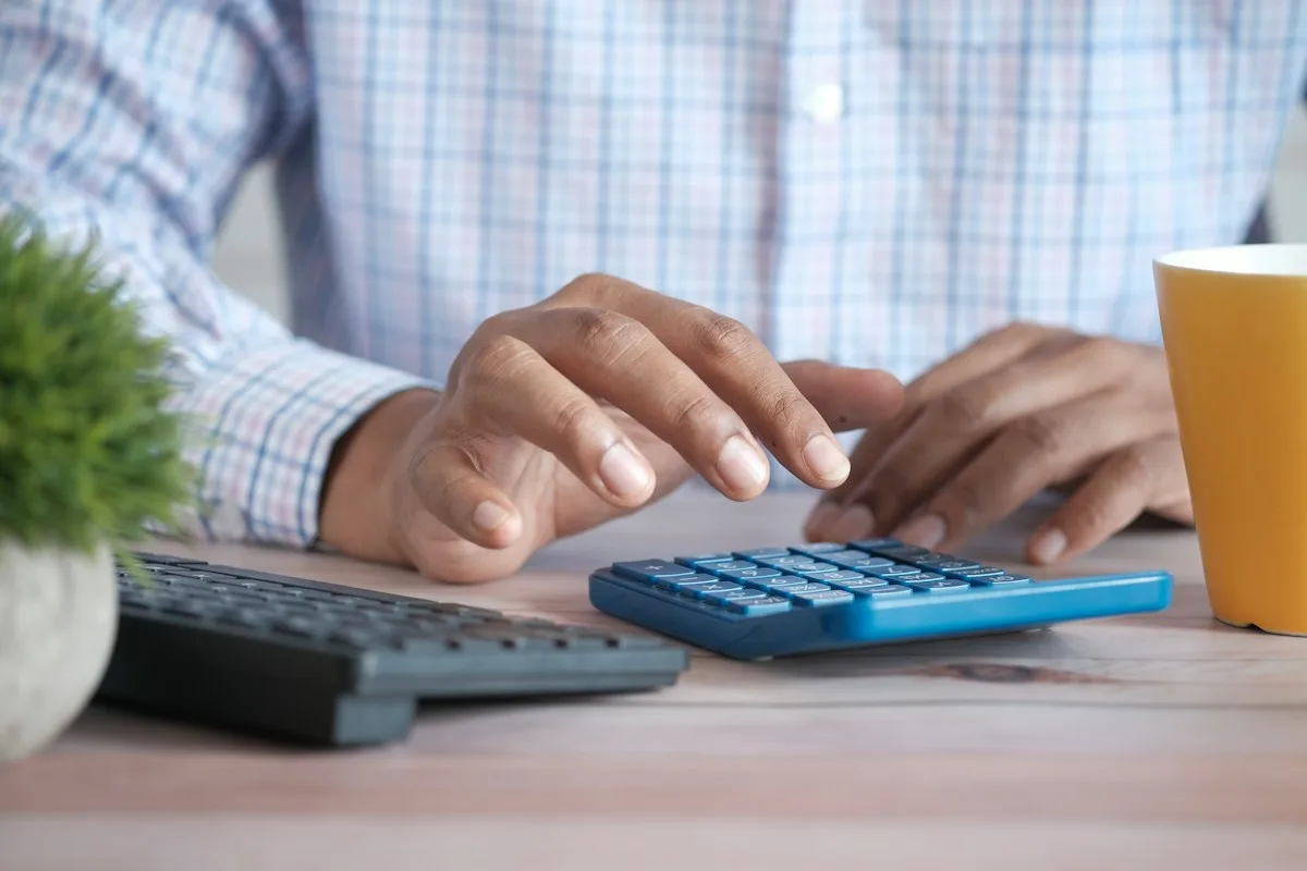 Student calculating costs to study in Germany for free at a public university