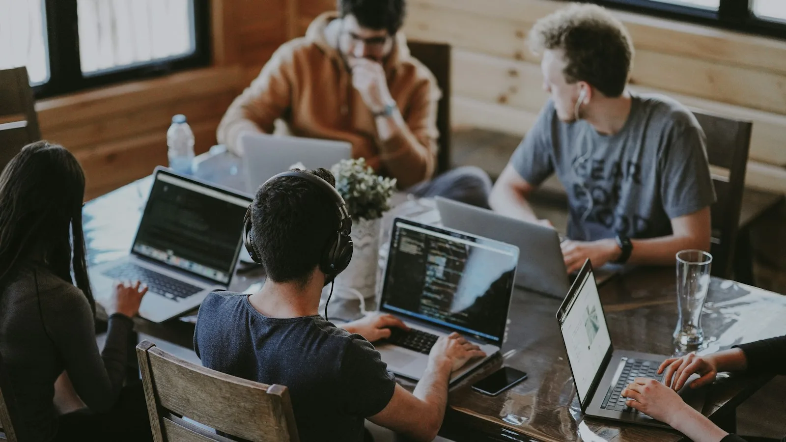 Team of skilled workers on laptops, typical of Critical Skills Employment Permit roles