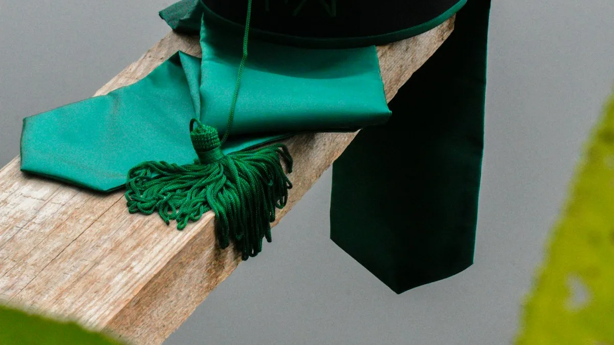 Graduation cap with a green tassel representing a scholarship award