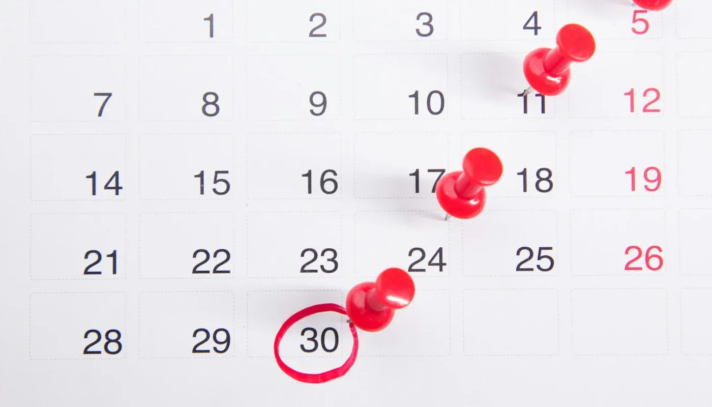 Calendar with pinned dates showing when to apply for scholarships